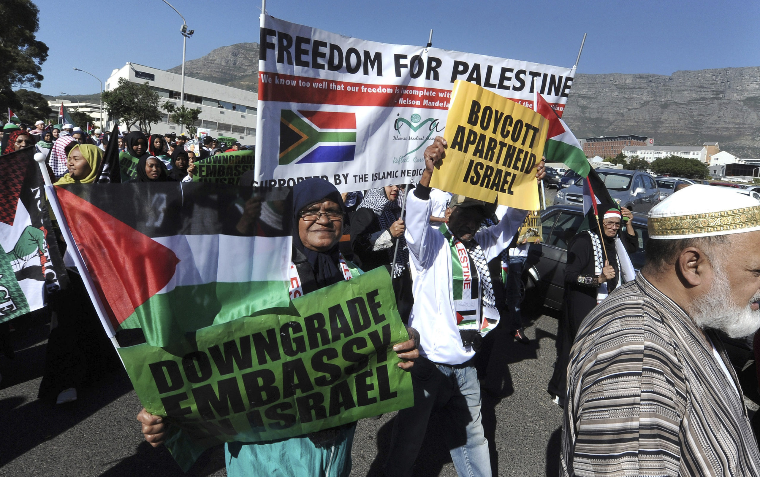 Protesters take part in a march to parliament in Cape Town, South Africa, Tuesday, May 15, 2018