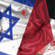 Flags of Israel and Palestine spattered with blood