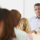 Teacher speaking in front of class