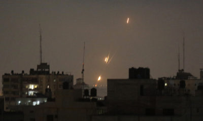 Flames from Palestinian rockets seen over the Gaza Strip