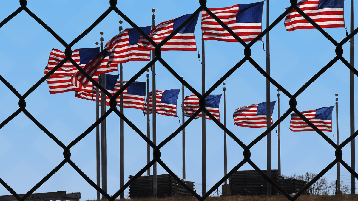 Picture of American flags at U.S.-Mexico border.