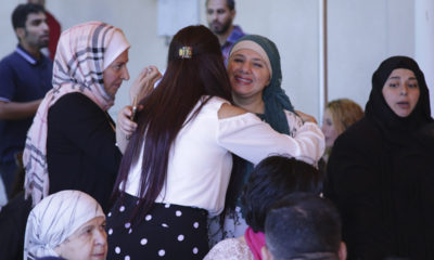 Photo of Muslims hugging at the end of the Ramadan Fast in Fresno, CA.