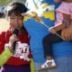 AP photo of child crying as she talks about being separated from her father
