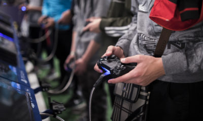 Photo of young men playing video games