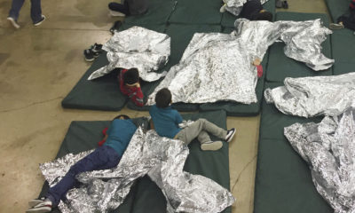 Photo of kids on floor of immigration holding facility in McAllen, Texas