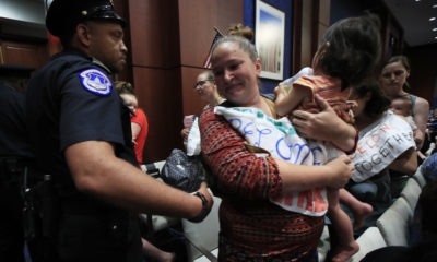 Photo of Lucy Martin and her daughter Branwen Espinal, who are removed from the hearing floor of the House.