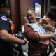 Photo of Lucy Martin and her daughter Branwen Espinal, who are removed from the hearing floor of the House.