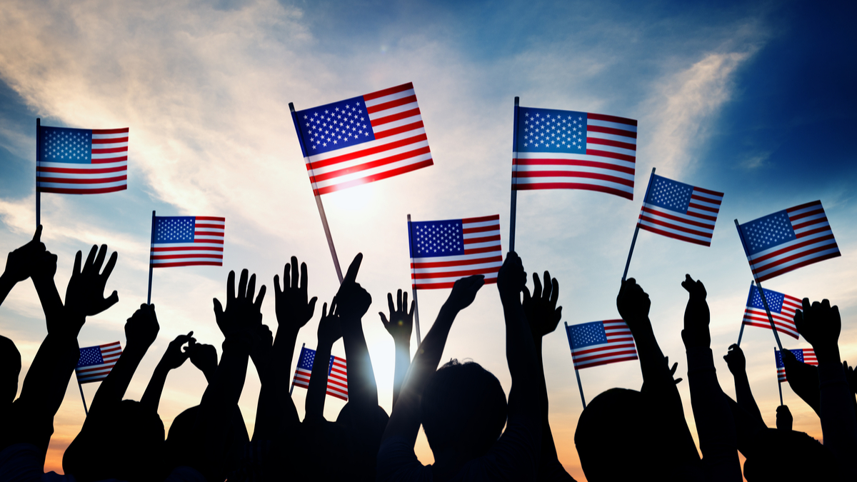 Photo of July 4th revelers holding American flags