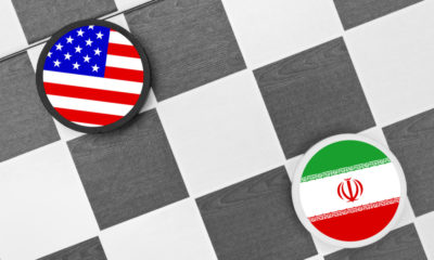 Illustration of US and Iran flags on a checkerboard