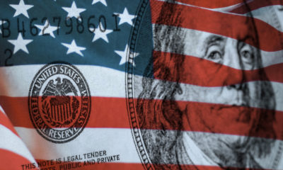 Federal Reserve Bank symbolized by American flag and Ben Franklin's image on a $100 bill