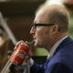 Photo of Assemblyman Matthew Harper sipping a Coca-Cola
