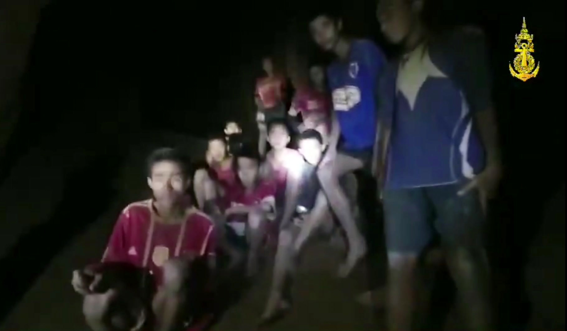 Photo of Thai soccer boys and their coach in the cave