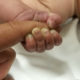 Photo of baby with dirty fingernails