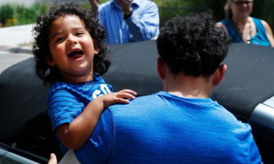 Child reuniting with his father after being released from ICE