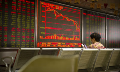 Photo of a Chinese investor monitoring stock prices