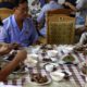 Photo of men in North Korea eating dishes made with dog meat