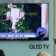 Photo of TV screen showing a satellite image of North Korea's Sohae launch site