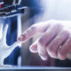 Photo of a 3D printer creating a plastic hand