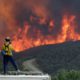 Photo of a fire crew keeping an eye on an advancing wildfire in SLO