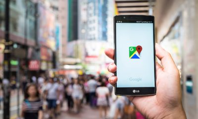 Stock photo of someone holding a smartphone, using google maps