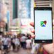 Stock photo of someone holding a smartphone, using google maps