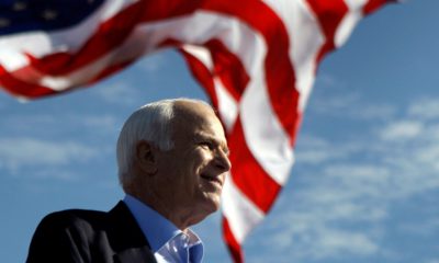 Photo of John McCain in front of an American flag