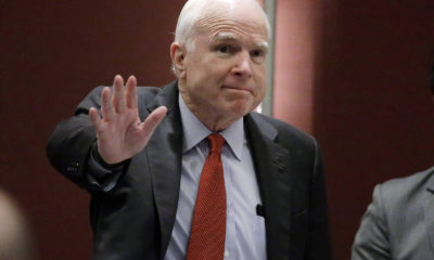 Photo of John McCain waving to the audience