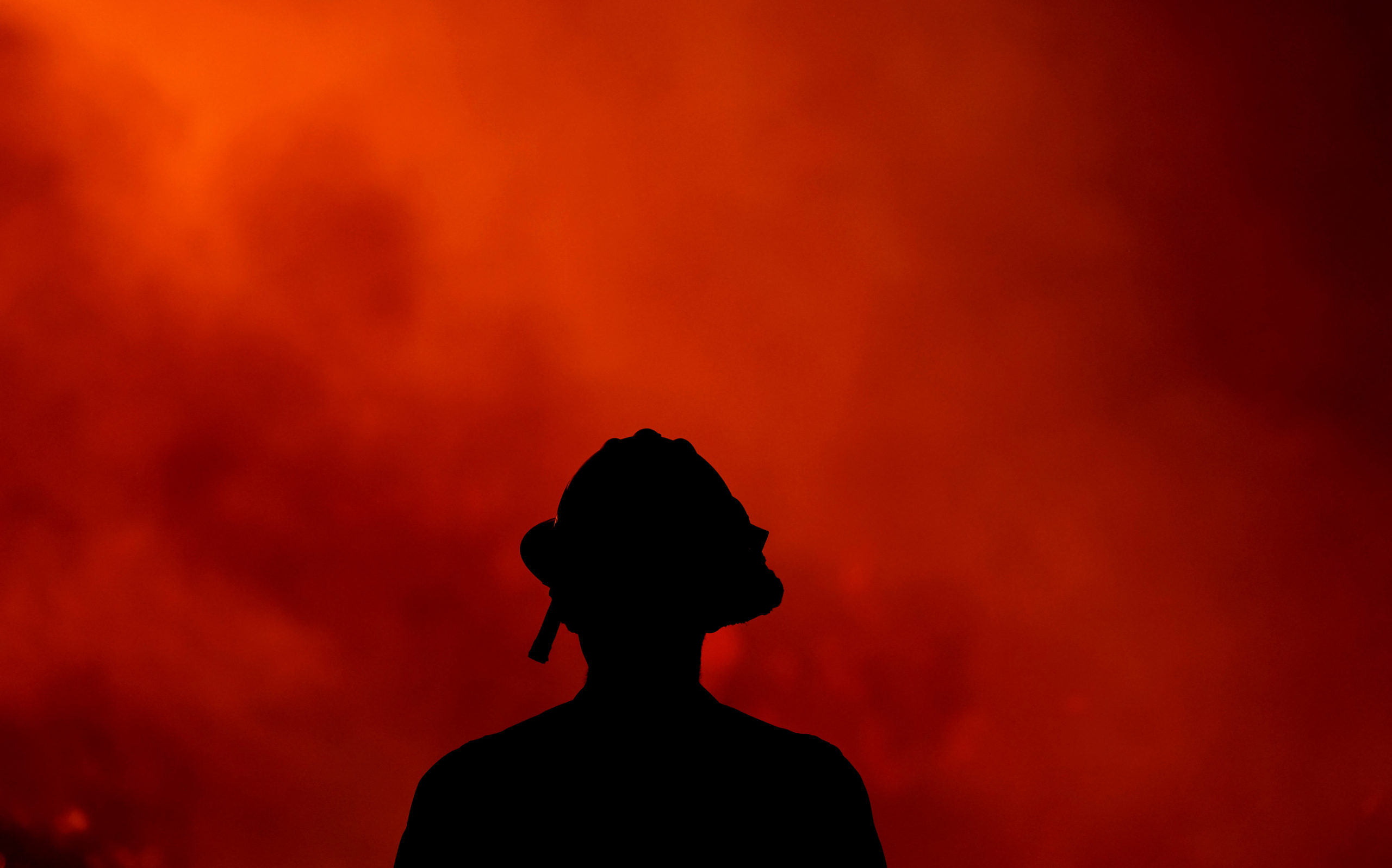A firefighter keeps an eye on the Holy Fire in southern California.