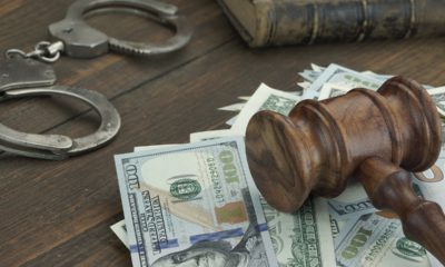 Stock photo of money, gavel, and handcuffs