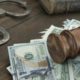 Stock photo of money, gavel, and handcuffs