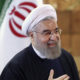 Iran President Hassan Rouhani in front of national flag