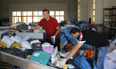 Palestinian postal workers sort through 8 years of mail held by Israel.