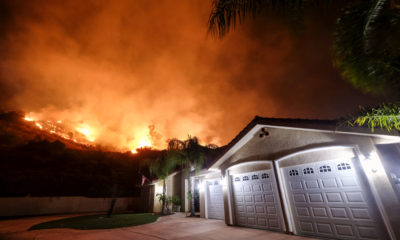 Photo of fire burning near a neighborhood in Lake Elsinore, Calif.