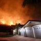 Photo of fire burning near a neighborhood in Lake Elsinore, Calif.