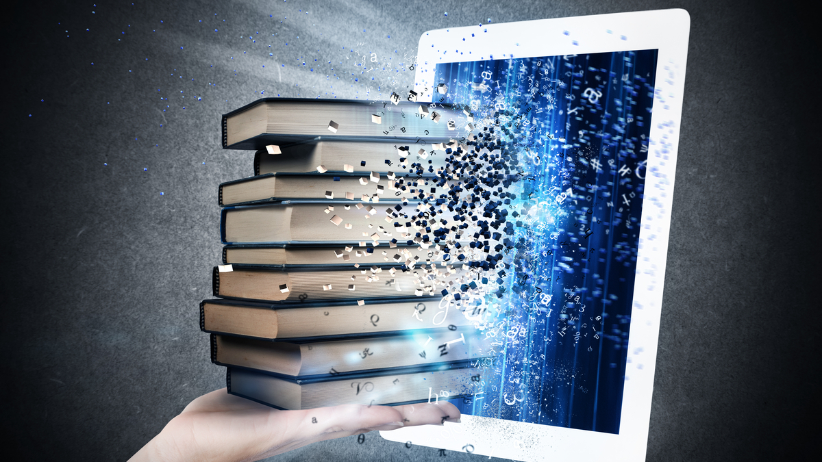 Photo Illustration of a pile of books being absorbed by a laptop