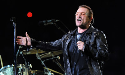 U2 lead singer Bono performing on stage