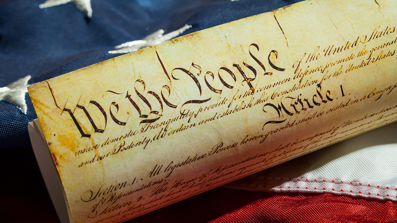 Photo of U.S. Constitution and American flag