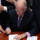 Photo of Jerry Brown signing another bill