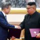 Photo of Kim Jong Un and Moon Jae-in shaking hands