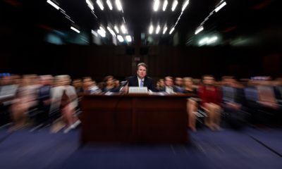 Photo of Kavanaugh in court with a slow shutter speed effect