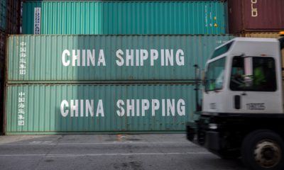 Photo of truck passing China Shipping containers in Savannah, GA