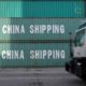 Photo of truck passing China Shipping containers in Savannah, GA