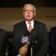 Photo of Riyad al-Maliki speaking to reporters