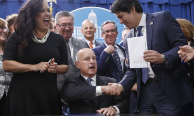 Photo of Gov. Brown signing an environmental bill