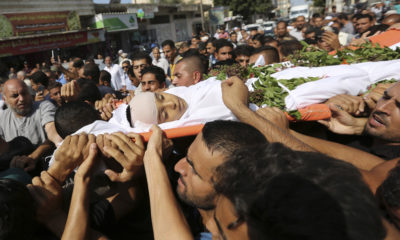 Mourners carry body of Palestinian victirm