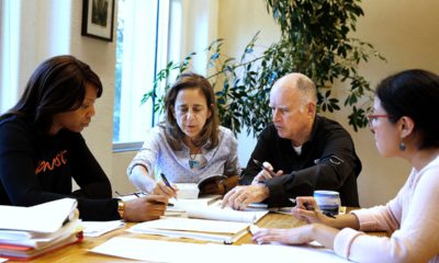 Photo of Gov. Jerry Brown reviewing a measure with his wife