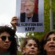Photo of activists protesting with photos of missing Saudi journalist Jamal Khashoggi