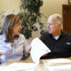 Photo of Gov. Jerry Brown and his wife, Anne Gust Brown, going over legislation.