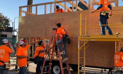Photo of students working on a tiny house at Career Tech Expo.
