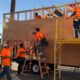 Photo of students working on a tiny house at Career Tech Expo.